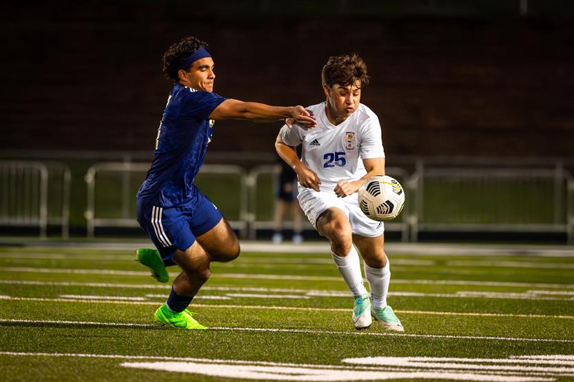 Students play soccer